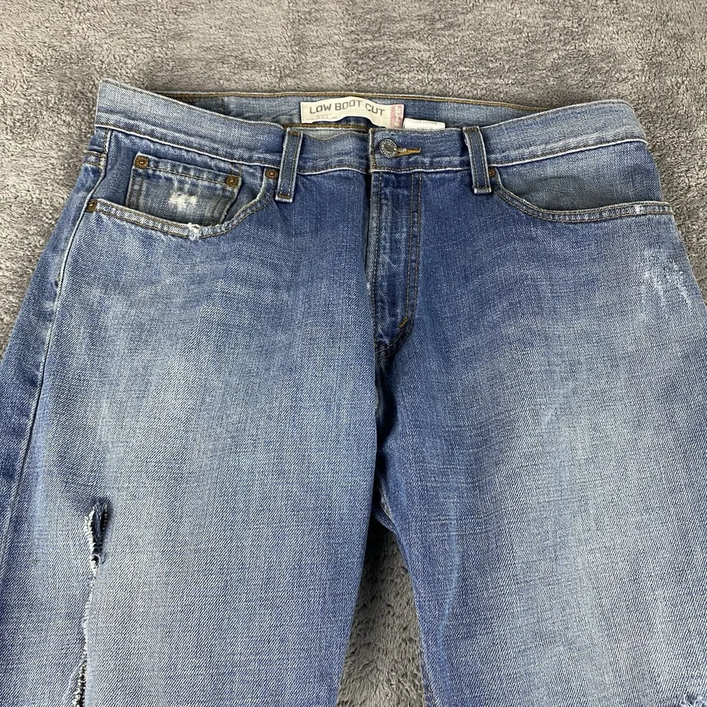 Levis 527 Low Boot Cut Jeans Mens 34x30 Blue Medium Wash Mid Rise Distressed Rip